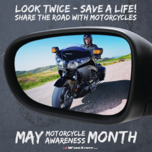 Picture of driver's side car mirror, with Honda Goldwing approaching in the mirror. Text above and below the image Look Twice - Save a Life! Share the Road with Motorcycles. May Motorcycle Awareness Month