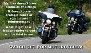 Two motorcycles approaching in a turn on asphalt roadway. The text reminds motorists to watch out for motorcycles because they do not have airbags and crumple zones.